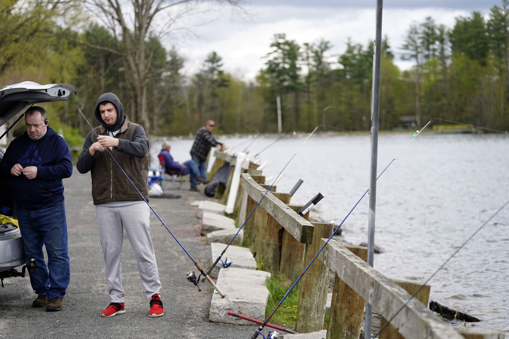 Fisherman on pier in Lee
